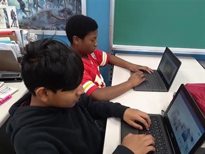 2 students on ChromeBooks